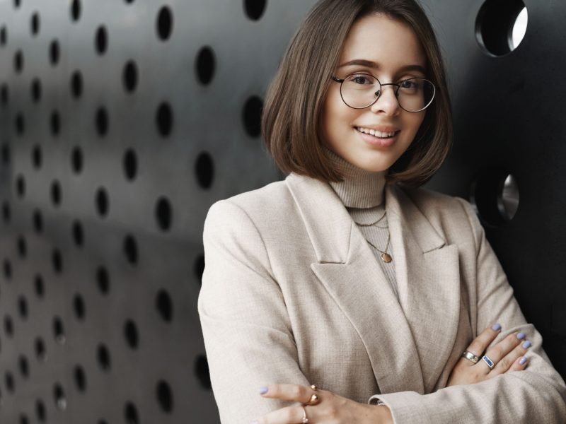 career-opportunities-women-education-concept-close-up-portrait-stylish-smiling-woman-looking-camera-with-pleased-confident-look-cross-hands-chest-lean-office-wall