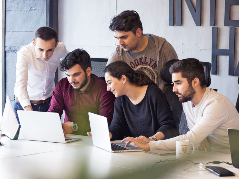 colleagues-working-project-discussing-details